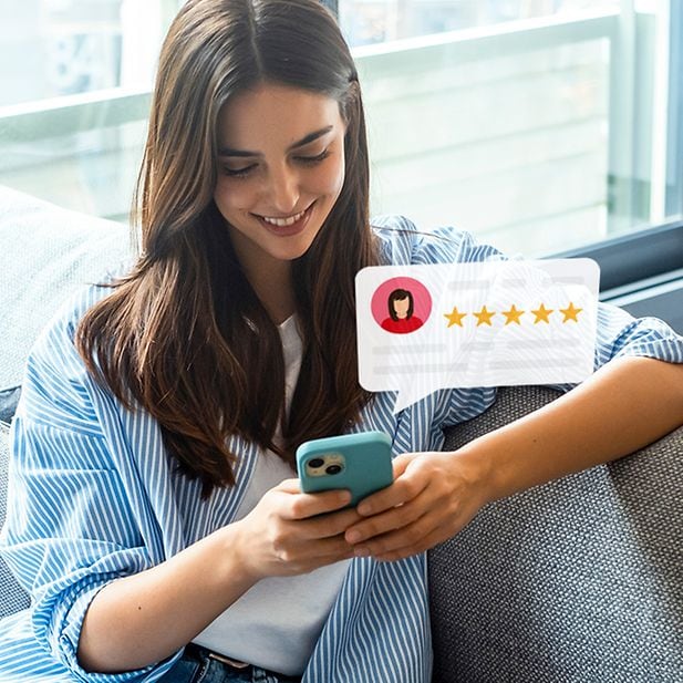 A woman reads the Trustpilot reviews for Vision Direct that other customers have posted on the platform.