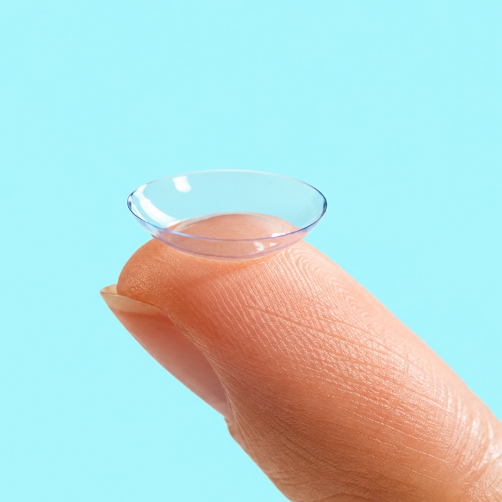 Contact lens on the tip of a finger